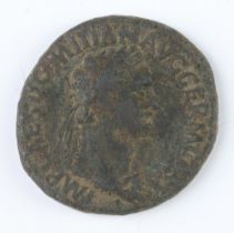 A brass dupondius coin of Domitian, the reverse shows the facade of an altar enclosure with double