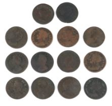 A collection of British farthings coins including Charles II, William and Mary, George I and