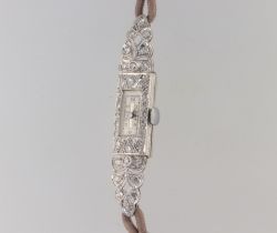 A lady's Art Deco platinum diamond set cocktail watch 55mm x 10mm on a silk strap This watch is