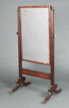 A 19th Century rectangular plate cheval mirror contained in a mahogany swing frame, the base with