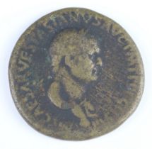 A Roman brass sestertius coin for Vespasian, 69-69AD, the reverse shows Liberty standing, holding