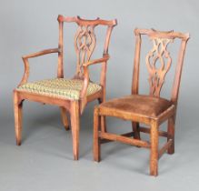 A 19th Century mahogany carver chair with pierced vase shaped slat back and drop in seat, raised