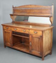 A Victorian oak chiffonier sideboard, the arched mirrored back fitted a shelf, the base a drawer