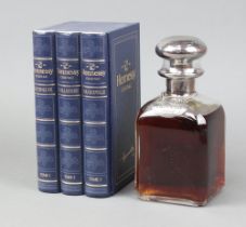 A 70cl decanter shaped bottle of Henessey Cognac contained in a presentation box in the form of