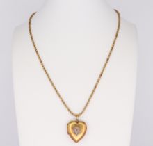 A yellow metal necklace 56cm, 9.6 grams and a yellow metal 15ct heart shaped diamond set locket, the