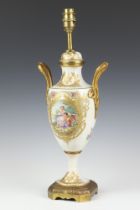 A French porcelain gilt metal mounted table lamp with fete gallant views on a raised metal base 35cm