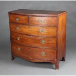 A Georgian crossbanded and inlaid mahogany bow front chest of 2 short and 3 long drawers with