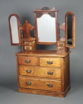 A Victorian mahogany dressing chest with triple plate mirror fitted 4 glove drawers above 2 short