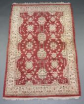 A brown and white ground Caucasian style floral patterned rug 184cm x 122cm Flecking in places,