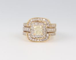 An 18ct yellow gold radiant cut light yellow diamond ring, approx. 1ct surrounded by 26 brilliant