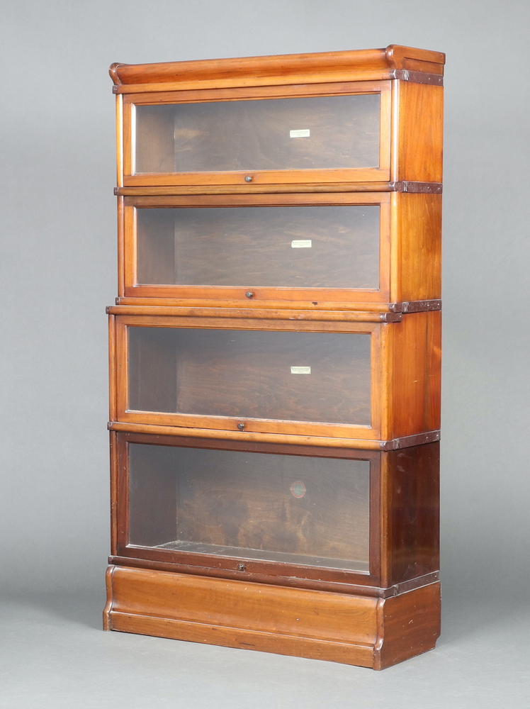 A Globe Wernicke 4 tier mahogany bookcase enclosed by glazed panelled doors 152cm h x 87cm w x