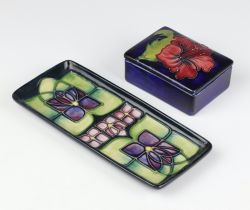 A modern Moorcroft rectangular tray decorated with stylised flowers 19cm, a ditto rectangular box,