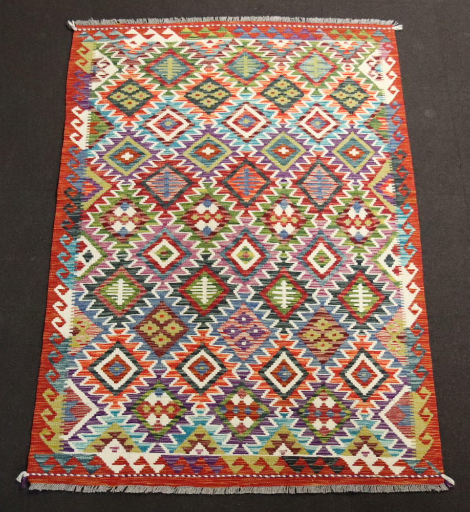 An orange, purple, blue and green ground Chobi Kilim rug with all over diamond design 197cm x 130cm