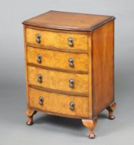 A Queen Anne style quarter veneered figured walnut bow front chest of 4 drawers, raised on