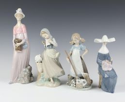 A Lladro figure of a girl with kittens 5239 21cm, ditto of a seated nun 5501 20cm, a girl with doves