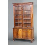 A Queen Anne style walnut display cabinet with moulded and dentil cornice, fitted adjustable shelves