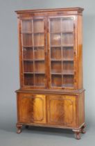 A Queen Anne style walnut display cabinet with moulded and dentil cornice, fitted adjustable shelves