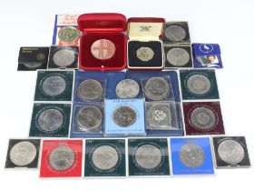 A collection of commemorative crowns and coins