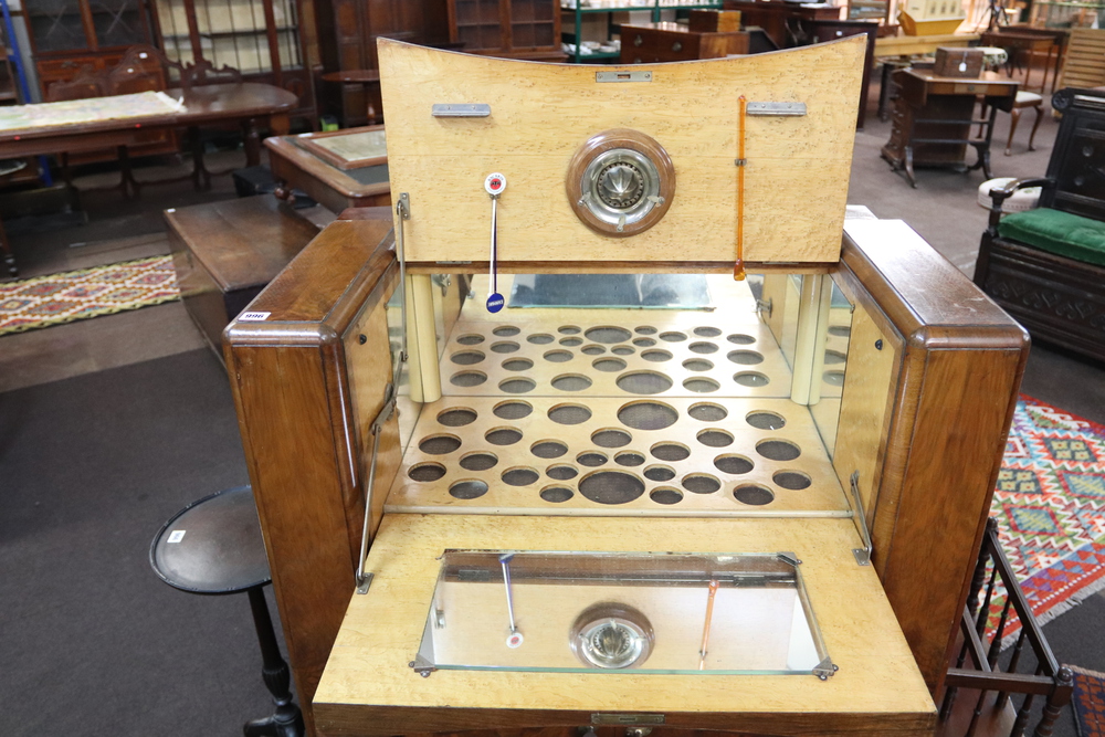 In the manner of Epstein, an Art Deco figured walnut cocktail cabinet with hinged lid and cupboard - Image 3 of 3