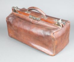 A brown leather Gladstone bag 20cm x 44cm x 23cm d Some light scuffing to high points