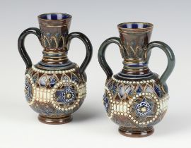 A pair of Doulton Lambeth 2 handled baluster vases with geometric decoration 13cm