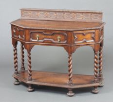 A 1920's, 17th Century style, oak Credence table with geometric mouldings and raised back, fitted