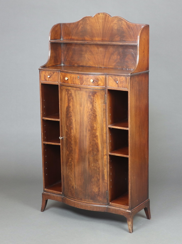 A Georgian style mahogany bow front bookcase with raised back fitted a shelf and recess above 1 long