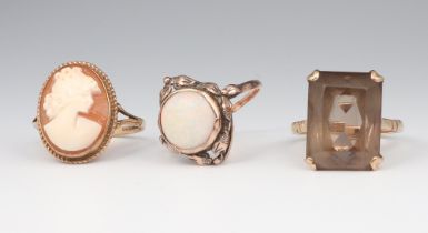 A 9ct yellow gold smokey quartz ring, a ditto opal ring and cameo ring sizes N 1/2, P and P, gross