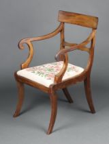 A 19th Century bleached mahogany bar back carver chair with Berlin woodwork drop in seat, raised