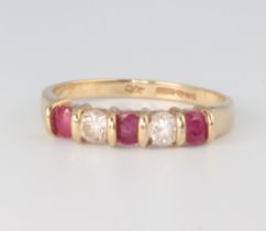 A yellow metal 9ct paste set half eternity ring size M, 1.6 grams