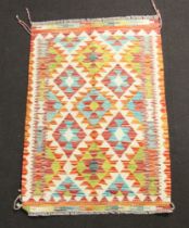 A yellow, white, gold and turquoise Chobi Kilim rug 123cm x 80cm