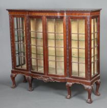 An Edwardian Chippendale style bow front display cabinet, fitted shelves enclosed by astragal glazed