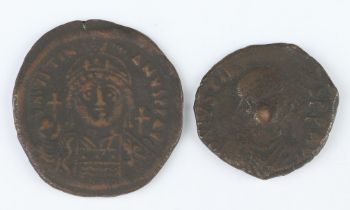 A pair of brass coins of Justinian minted by the Byzantine States in 527-565AD, a brass sestertius