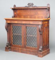 A William IV rosewood chiffonier, the raised back fitted a shelf, the base enclosed by glazed and