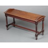 An Edwardian rectangular mahogany hall/Windsor chair raised on turned supports with H framed