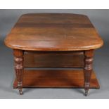 A Victorian mahogany oval extending dining table with 2 extra leaves, raised on turned and fluted