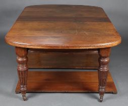 A Victorian mahogany oval extending dining table with 2 extra leaves, raised on turned and fluted