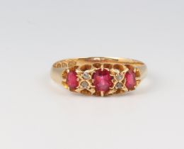 An 18ct yellow gold ruby and diamond ring size P 2.4 grams