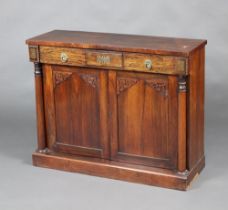 A William IV rosewood chiffonier fitted a drawer above cupboard enclosed by a panelled door with
