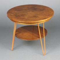 A 1950's walnut finished quarter veneered 2 tier occasional table with rotating top, raised on
