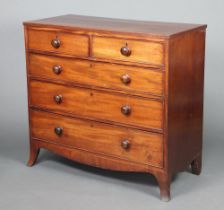 A 19th Century mahogany chest of 2 short and 3 long drawers with tore handles, raised on outswept