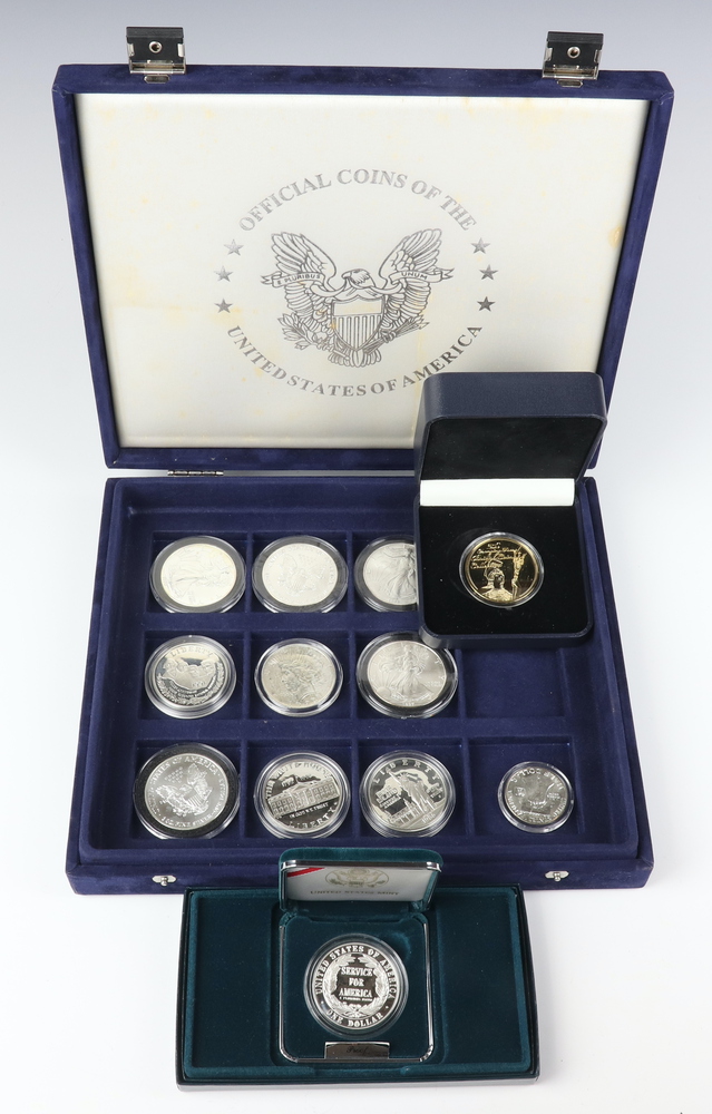 Nine silver commemorative American dollars, 2 silver commemorative crowns and a silver half