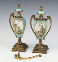 A pair of 19th Century French porcelain gilt metal mounted vases and covers decorated with