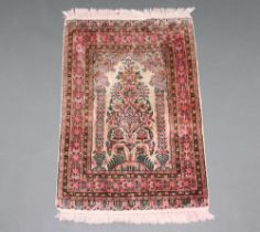 An Indian pink ground silk floral patterned prayer rug 93cm x 64cm