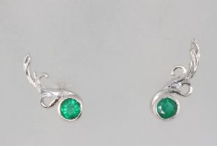 A pair of white metal emerald and diamond floral ear studs, the emeralds each approx. 0.15ct, 2