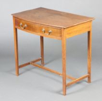 A 19th Century mahogany bow front side table fitted 1 long drawer, raised on square tapered supports