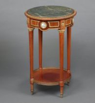 A circular mahogany Empire style occasional table with green veined marble top, gilt metal mounts