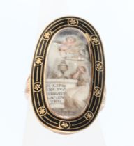 An 18th Century yellow metal mourning ring with enamelled decoration and painted panel, with