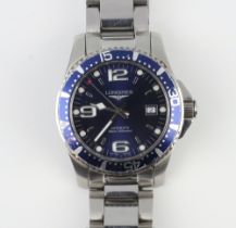 A gentleman's steel cased Longines blue dial calendar wristwatch with blue bezel on a steel bracelet