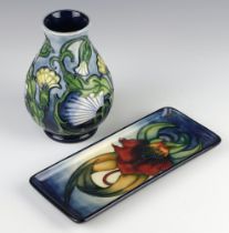 A modern Moorcroft pin tray 1998 9cm, together with a squat vase decorated with flowers 1996 13.5cm